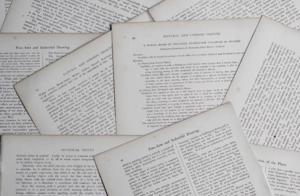 Sheets of paper scattered with headings like "Technical Points," "Natural and Common Objects," and "Free-Arm and Industrial Drawing." The pages contain writing tips for beginners against a plain background. Perfect for learning, writing, or teaching techniques. Creatorpoint – Creator Knowledge, Simplified. The best resources, podcast summaries, and learning for creators.