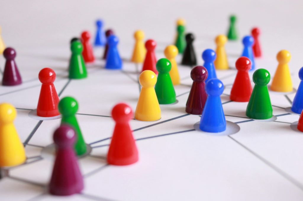 Colorful plastic game pieces resembling a network or organization chart, illustrating a structured podcast summary on a white background with black connecting lines. Creatorpoint – Creator Knowledge, Simplified. The best resources, podcast summaries, and learning for creators.