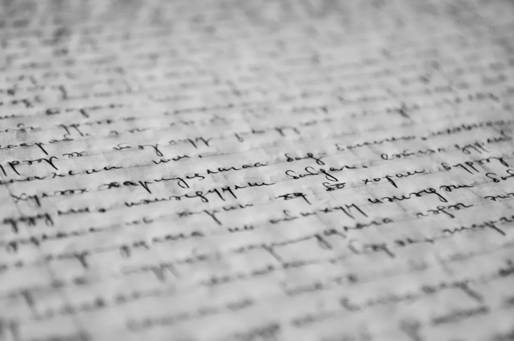 Alt text: "Close-up black-and-white image of dense, tightly spaced handwritten cursive text resembling podcast notes, evoking a detailed podcast summary. Creatorpoint – Creator Knowledge, Simplified. The best resources, podcast summaries, and learning for creators.