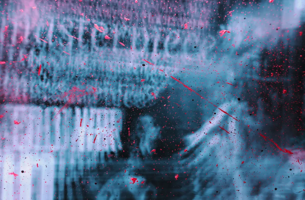 Abstract art with blue background, red splatters, and smudges. Mysterious scene resembles a storyteller's imagination with partial text and blurry figures. Chaotic visual effect capturing intrigue and creativity. Ideal for themes of mystery, storytelling, and artistic chaos. Creatorpoint – Creator Knowledge, Simplified. The best resources, podcast summaries, and learning for creators.